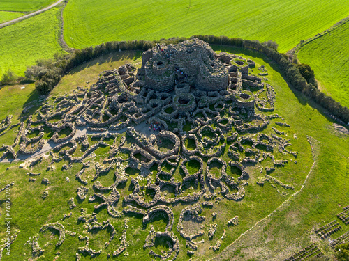 Aerial view with drone of the Nuragic archaeological complex of Su Nuraxi di Barumini. The Bronze Age fort, a UNESCO World Heritage Site. Barumini, Sardinia, Italy photo