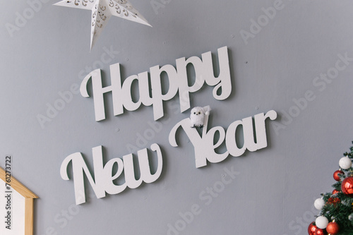 Obraz na płótnie Christmas decor, happy New Year inscription on a gray background w salonie