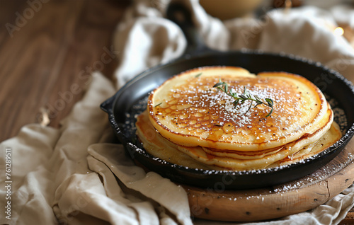Delicious pancakes on frying pan, top view