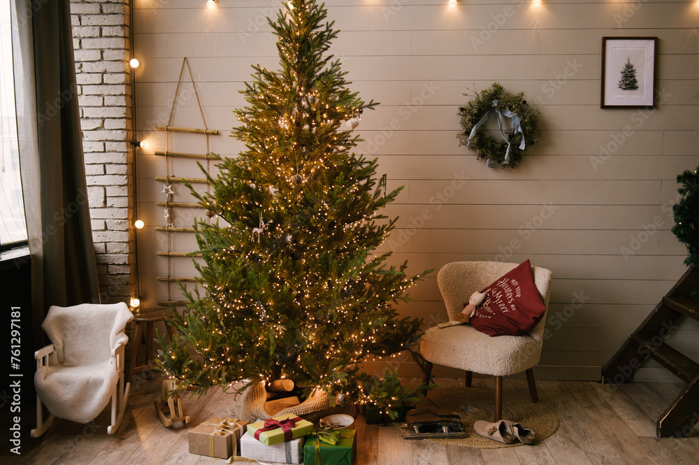 Beautiful New Year decor in a stylish interior with a Christmas tree, wreath and gifts