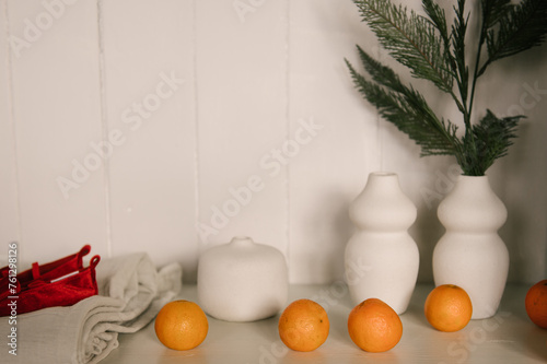 Obraz na płótnie Stylish interior with a white sideboard and a Christmas tree decorated for the new year w salonie