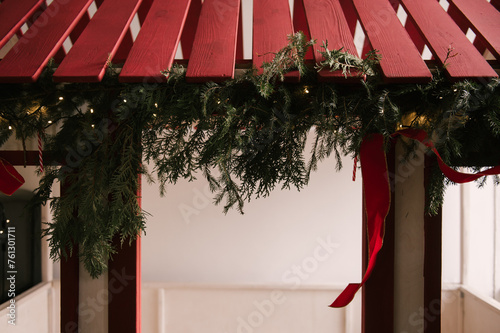 Beautiful stylish modern interior of a children s room with a wooden bed and a toy decorated for the new year