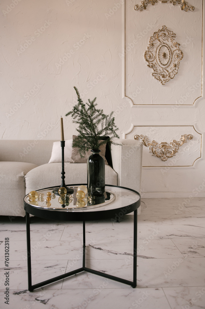 Stylish modern classic interior with sofa, table and stucco walls