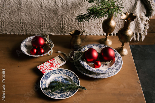 Obraz na płótnie Beautiful New Year decor, red balls in vintage plates and gold candlesticks w salonie