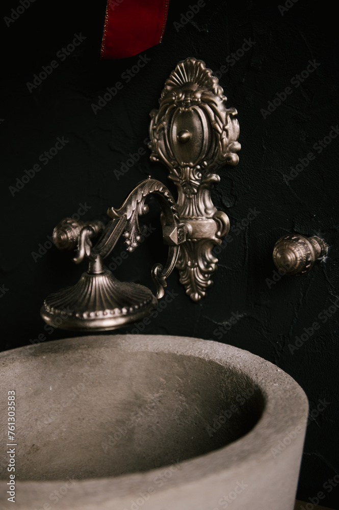 Stylish modern japandi interior, concrete sink with vintage faucets and mirror