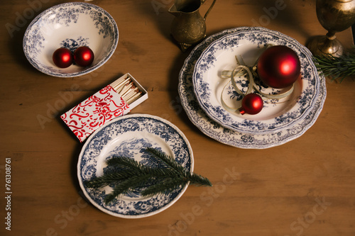 Obraz na płótnie Beautiful New Year decor, red balls in vintage plates and gold candlesticks w salonie