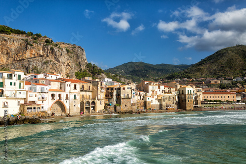 Cefalù is a coastal city in northern Sicily, Italy. Popular beach. Summer time.