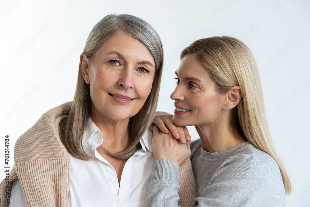 Mother and daughter feeling good with each other and looking contented Mother and daughter feeling good with each other and looking contented