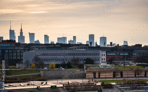 Warsaw, Poland - panorama of a city skyline at sunset. Cityscape view of Warsaw. Skyscrapers in Warsaw. Sunset over the river