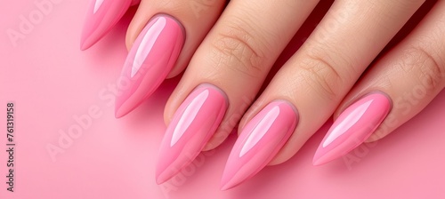 Close up of elegant woman s hand with stylish pink nail polish in glamorous shot