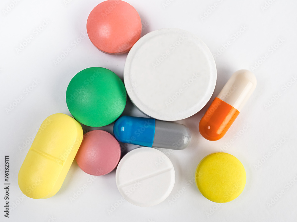 Pills, different colors, with selective focus.