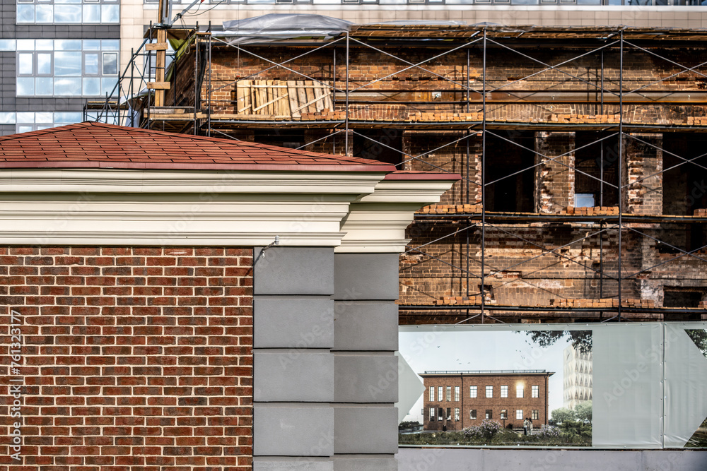 Restoration of an old wooden building using scaffolding.