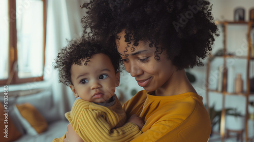 afro haired woman holding a cute baby, Ai Generated Images photo