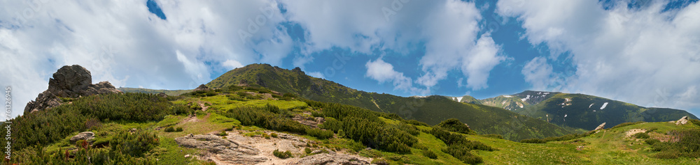 Summer mountain view with snow and big stones on mountainside. Five shots stitch image. Summer mountain view with snow and big stones on mountainside. Five shots stitch image.