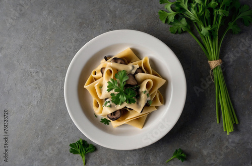 Mushroom pasta pappardelle with cream sauce and parsle photo