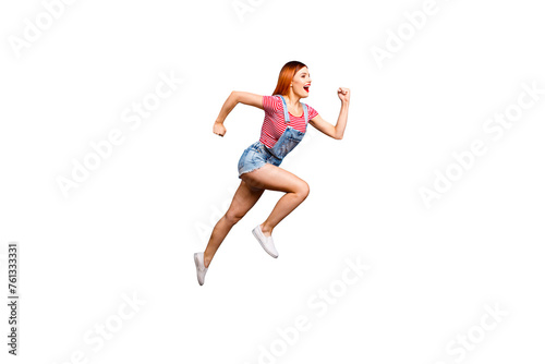 Full-size portrait of running marathon girl who looks in front of her isolated on bright blue background