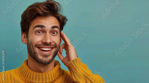 Man in Yellow Sweater Holding Cell Phone to Ear