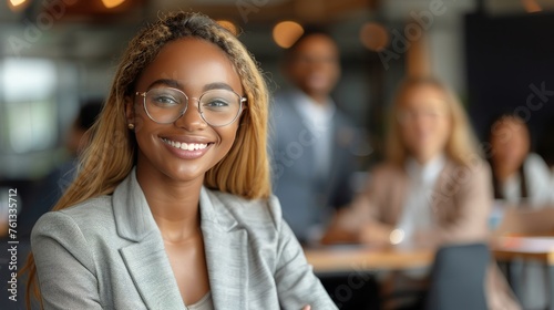 Woman With Glasses Sitting in Front of People