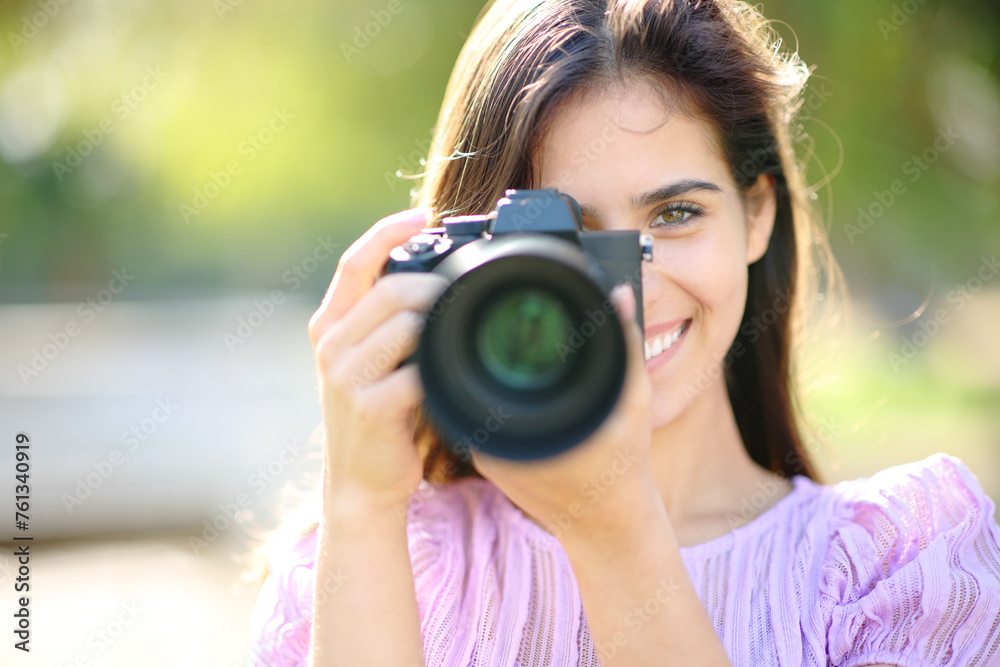 Happy photographer taking photo of you