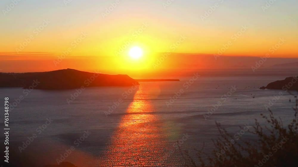 Cinematic aerial shot of famous in Santorini at sunset in Greece