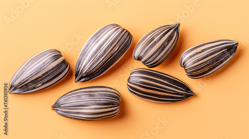 Wallpaper Mural commercial stock flat lay photo of small pile of about five raw white sunflower seeds against light tan background сreated with Generative Ai Torontodigital.ca