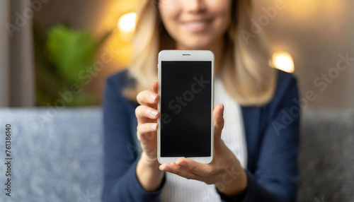Businesswoman holding a mobile phone. Business life and technology concept