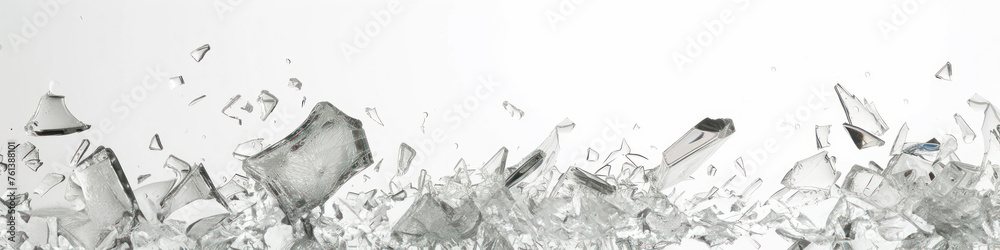 an array of broken glass pieces scattered against a white backdrop, a composition that may be utilized to convey themes of fragility or accidents in safety campaigns and artistic representations