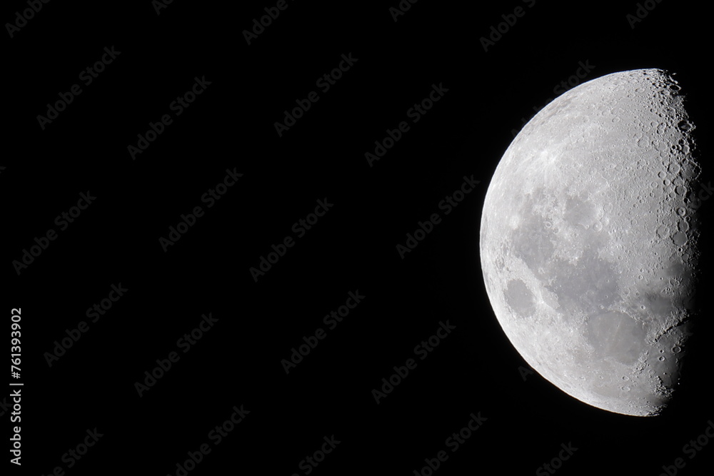 High resolution half moon photo on a uniform black background, which is ideal for use as a presentation slide template. The moon is located in the middle right to facilitate copy space for text. High resolution half moon photo on a uniform black background, which is ideal for use as a presentation slide template. The moon is located in the middle right to facilitate copy space for text.