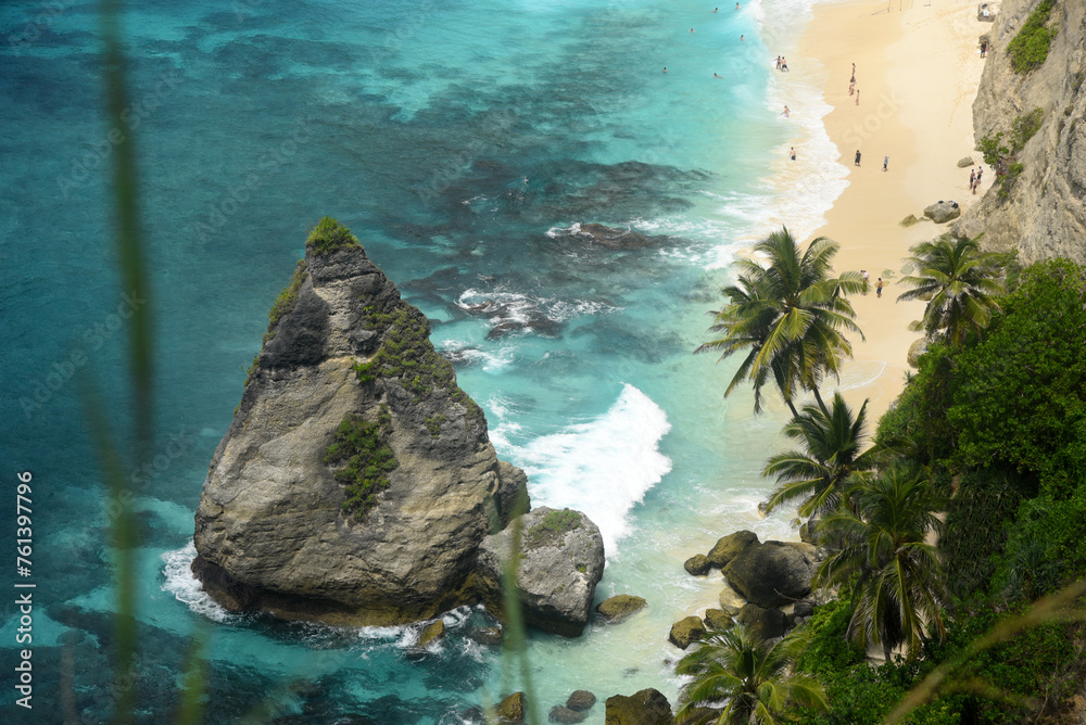 Diamond Beach, at Nusa Penida island of Bali, with beauty white cliff formation and white sand beach during day time Diamond Beach, at Nusa Penida island of Bali, with beauty white cliff formation and white sand beach during day time