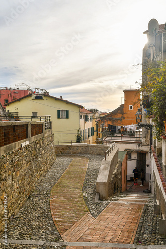 Glimpse of La Pigna district, the old town founded around the 11th century, with the typical uphill alleys at sunset, Sanremo, Imperia, Liguria, Italy photo