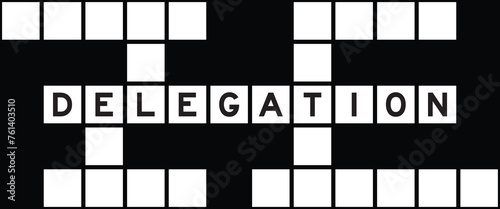 Alphabet letter in word delegation on crossword puzzle background © bankrx