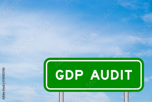 Green color transportation sign with word GDP (Good distribution practice) audit on blue sky with white cloud background photo