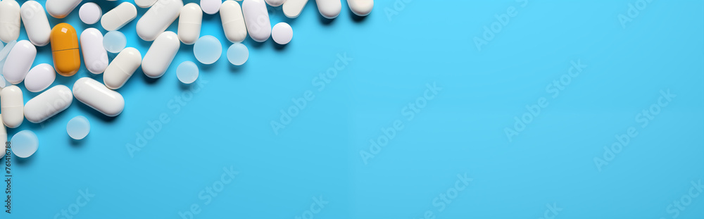 tablets and capsules in a corner of a blue background banner tablets and capsules in a corner of a blue background banner