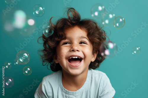 A playful kid model enjoying a moment of bliss, against a solid wall of mint background, blowing bubbles and giggling with pure joy.