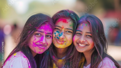 Three beautiful girls enjoying a colorful Holi celebration. Fictional character created by Generated AI. 