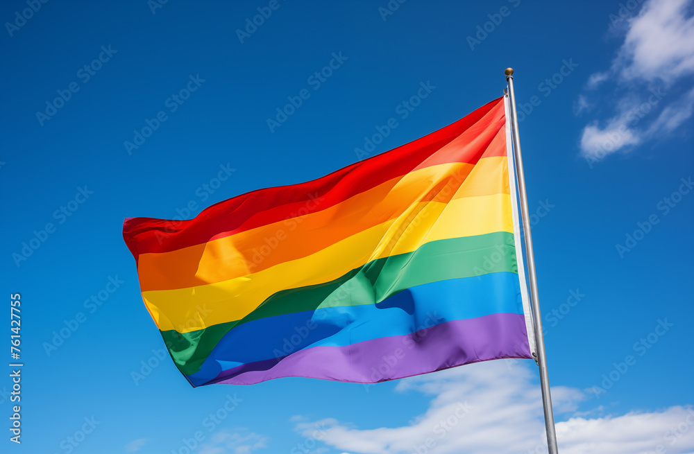 rainbow flag waving on the blue sky rainbow flag waving on the blue sky
