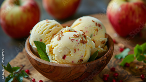 Homemade apple ice cream served in a rustic wooden bowl, garnished with mint leaves.