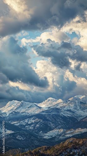 Idyllic view of snowcapped mountains against dramatic sky
