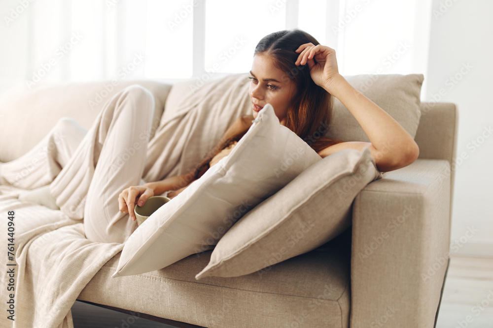 Cozy Morning: Mug, Coffee, Woman, Cup, Indoor, Drinking, Home, Lifestyle, Blanket, Morning, Drink, Smiling, Cozy, Happy, Tea. Cozy Morning: Mug, Coffee, Woman, Cup, Indoor, Drinking, Home, Lifestyle, Blanket, Morning, Drink, Smiling, Cozy, Happy, Tea.