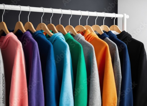 Row of different colorful youth cashmere sweaters and hoodies
