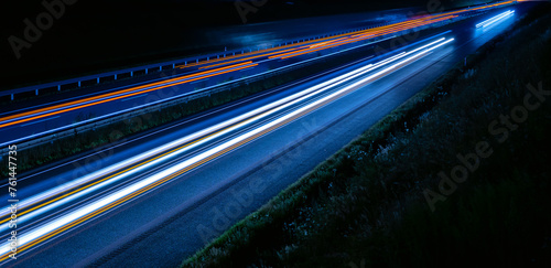 lights of cars driving at night. long exposure