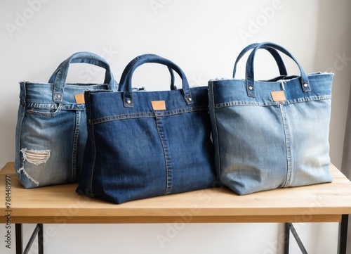 Handbags made from old jeans on a dressmaker table