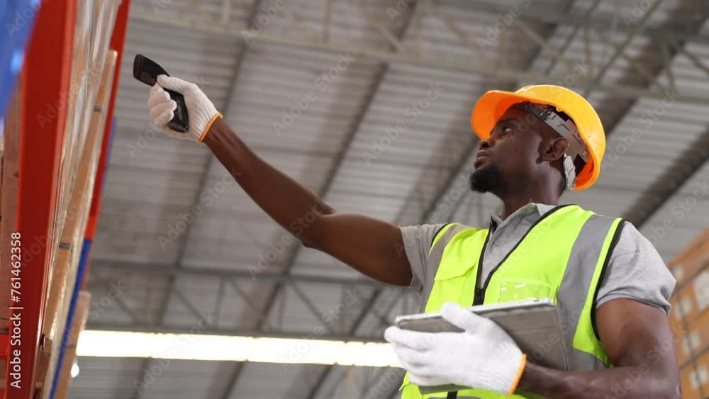 African American young man stock check and barcode scan in the warehouse. Holding a digital tablet in his hands. African American young man stock check and barcode scan in the warehouse. Holding a digital tablet in his hands.