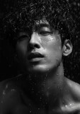 Curly-Haired Asian Model in Rain, Fashioncore Look, B&W Photography
