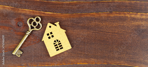 House and gold key. Real estate, home ownership banner.