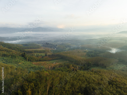 Aerial mountain peak sunrise tropical rainforest sky with cloud