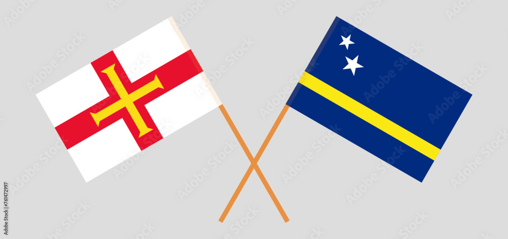Crossed flags of Bailiwick of Guernsey and Country of Curacao. Official colors. Correct proportion