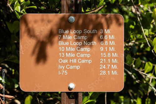 A sign at the southern terminus of the Cross Seminole Trail, Florida, with northbound mileage
