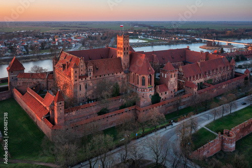 Malbork castle over the Nogat river at sunset, Poland