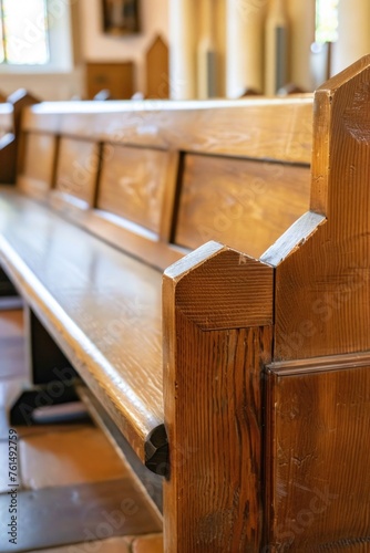 A wooden bench inside a church, suitable for religious themes